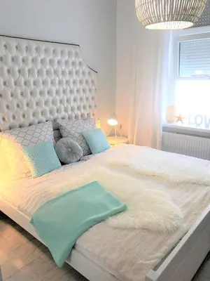 Łóżko lub łóżka w pokoju w obiekcie Apartament BellaPola 2