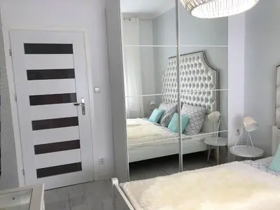 Łóżko lub łóżka w pokoju w obiekcie Apartament BellaPola 2