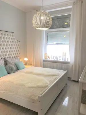 Łóżko lub łóżka w pokoju w obiekcie Apartament BellaPola 2