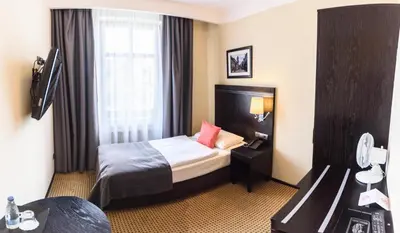 Łóżko lub łóżka w pokoju w obiekcie Hotel Fado Spa & Restaurant