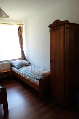 Łóżko lub łóżka w pokoju w obiekcie Dom Pod Siódemką