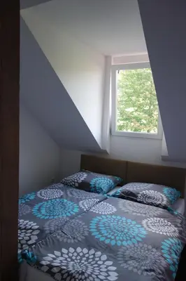 Łóżko lub łóżka w pokoju w obiekcie Dom Pod Siódemką