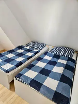 Łóżko lub łóżka w pokoju w obiekcie Domek Letniskowy Głebinów