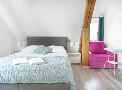 Łóżko lub łóżka w pokoju w obiekcie Parkowy Kudowa