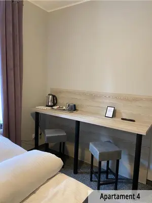 Łóżko lub łóżka w pokoju w obiekcie Willa przy Czarnej Bramie