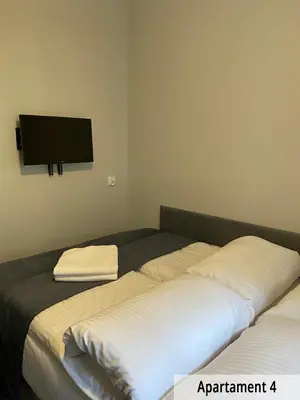 Łóżko lub łóżka w pokoju w obiekcie Willa przy Czarnej Bramie