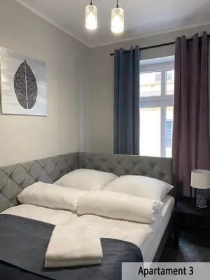 Łóżko lub łóżka w pokoju w obiekcie Willa przy Czarnej Bramie