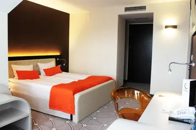 Łóżko lub łóżka w pokoju w obiekcie Hotel Eclipse