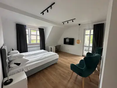 Łóżko lub łóżka w pokoju w obiekcie Pensjonat Kapitan