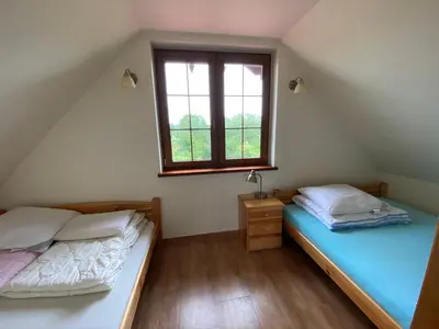Łóżko lub łóżka w pokoju w obiekcie Ignacówka