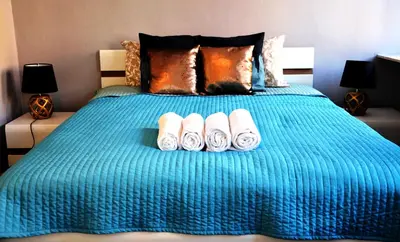 Łóżko lub łóżka w pokoju w obiekcie Apartament Rynek