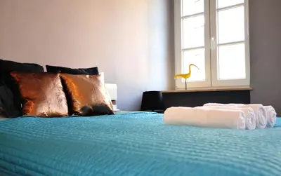 Łóżko lub łóżka w pokoju w obiekcie Apartament Rynek