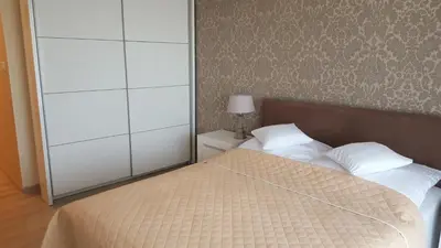 Łóżko lub łóżka w pokoju w obiekcie Wrocław APARTAMENTY KĘPA MIESZCZAŃSKA