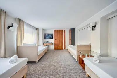 Łóżko lub łóżka w pokoju w obiekcie Hotelik B&B Pod Dębami