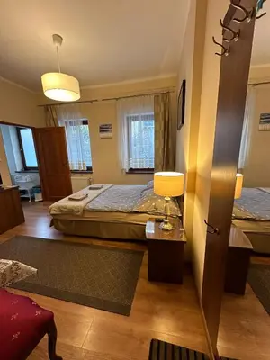 Łóżko lub łóżka w pokoju w obiekcie Pokoje Gościnne Złota Palma