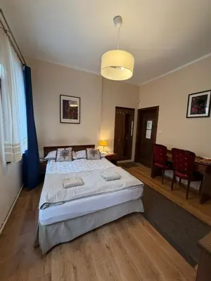 Łóżko lub łóżka w pokoju w obiekcie Pokoje Gościnne Złota Palma