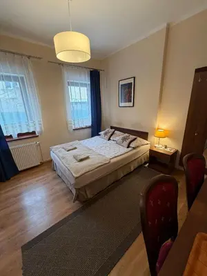 Łóżko lub łóżka w pokoju w obiekcie Pokoje Gościnne Złota Palma