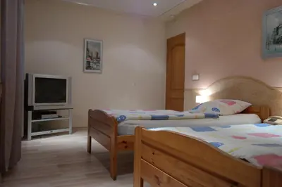 Łóżko lub łóżka w pokoju w obiekcie VillaMirage