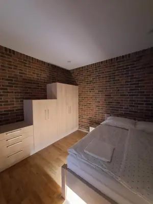 Łóżko lub łóżka w pokoju w obiekcie Hotel Alhar