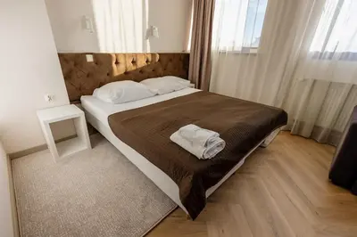 Łóżko lub łóżka w pokoju w obiekcie Hotel Wena