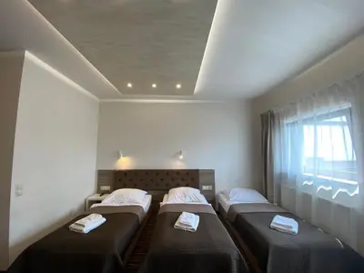Łóżko lub łóżka w pokoju w obiekcie Hotel Wena