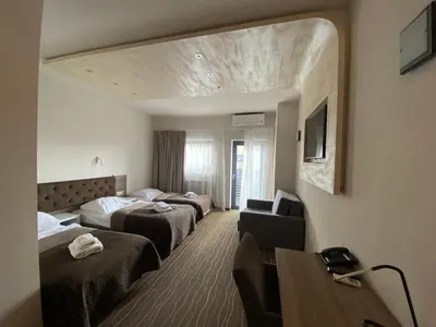 Łóżko lub łóżka w pokoju w obiekcie Hotel Wena