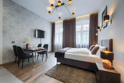 Łóżko lub łóżka w pokoju w obiekcie Abba Apartments