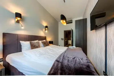Łóżko lub łóżka w pokoju w obiekcie Abba Apartments