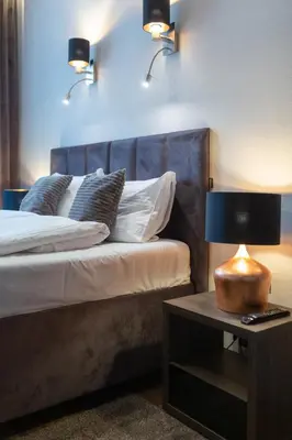 Łóżko lub łóżka w pokoju w obiekcie Abba Apartments