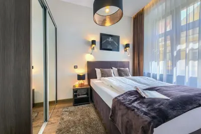 Łóżko lub łóżka w pokoju w obiekcie Abba Apartments