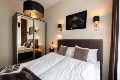 Łóżko lub łóżka w pokoju w obiekcie Abba Apartments