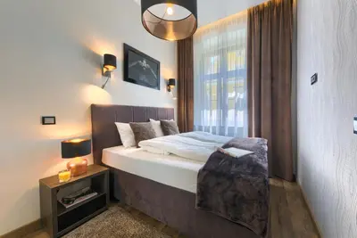 Łóżko lub łóżka w pokoju w obiekcie Abba Apartments