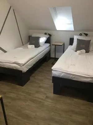 Łóżko lub łóżka w pokoju w obiekcie Kimanoclegi