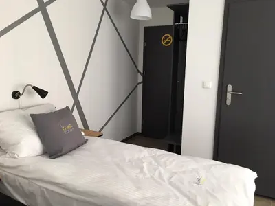 Łóżko lub łóżka w pokoju w obiekcie Kimanoclegi