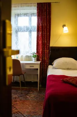 Łóżko lub łóżka w pokoju w obiekcie Hotel Maria Helena