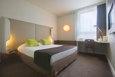 Łóżko lub łóżka w pokoju w obiekcie Campanile Wroclaw Centrum