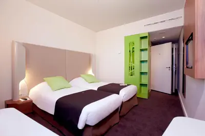 Łóżko lub łóżka w pokoju w obiekcie Campanile Wroclaw Centrum