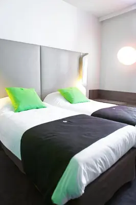 Łóżko lub łóżka w pokoju w obiekcie Campanile Wroclaw Centrum