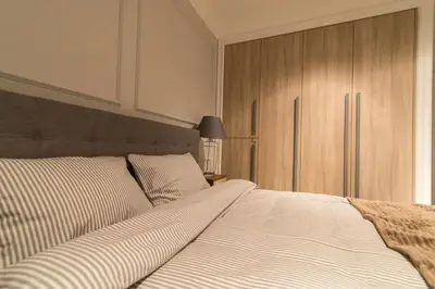 Łóżko lub łóżka w pokoju w obiekcie LuxApart Kalisz V.I.P