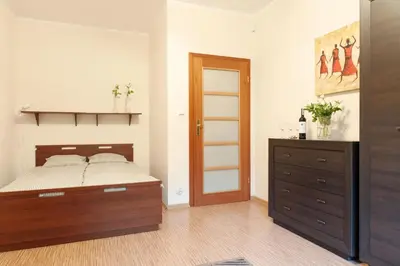 Łóżko lub łóżka w pokoju w obiekcie Apartament TSO Parkowa Polana