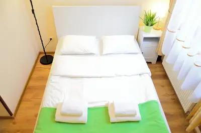 Łóżko lub łóżka w pokoju w obiekcie WenderEDU Business Center