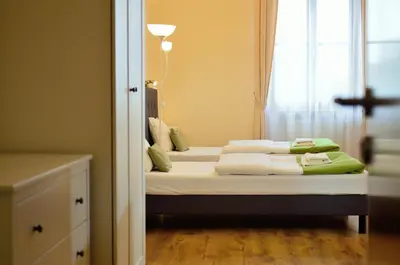 Łóżko lub łóżka w pokoju w obiekcie WenderEDU Business Center
