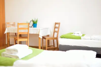 Łóżko lub łóżka w pokoju w obiekcie WenderEDU Business Center