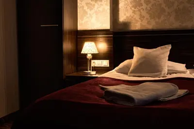 Łóżko lub łóżka w pokoju w obiekcie Hotel Racibor