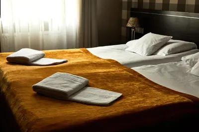 Łóżko lub łóżka w pokoju w obiekcie Hotel Racibor