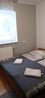 Łóżko lub łóżka w pokoju w obiekcie Agroturystyka U Baltazara