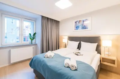 Łóżko lub łóżka w pokoju w obiekcie Q17 Apartments Rynek