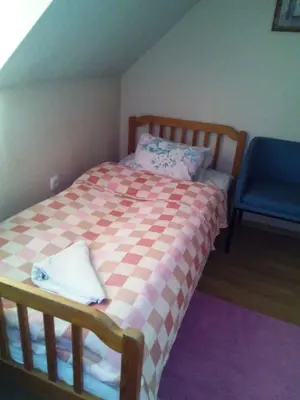 Łóżko lub łóżka w pokoju w obiekcie Gościniec ELLA INN Lipniki