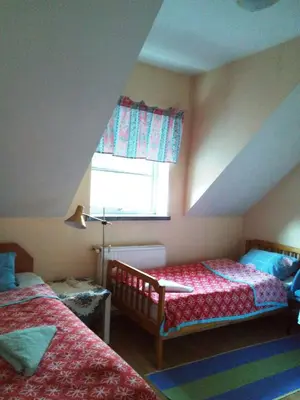 Łóżko lub łóżka w pokoju w obiekcie Gościniec ELLA INN Lipniki
