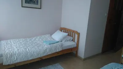 Łóżko lub łóżka w pokoju w obiekcie Gościniec ELLA INN Lipniki